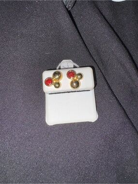 Gold Silhouette Stud Earrings with Red Crystals